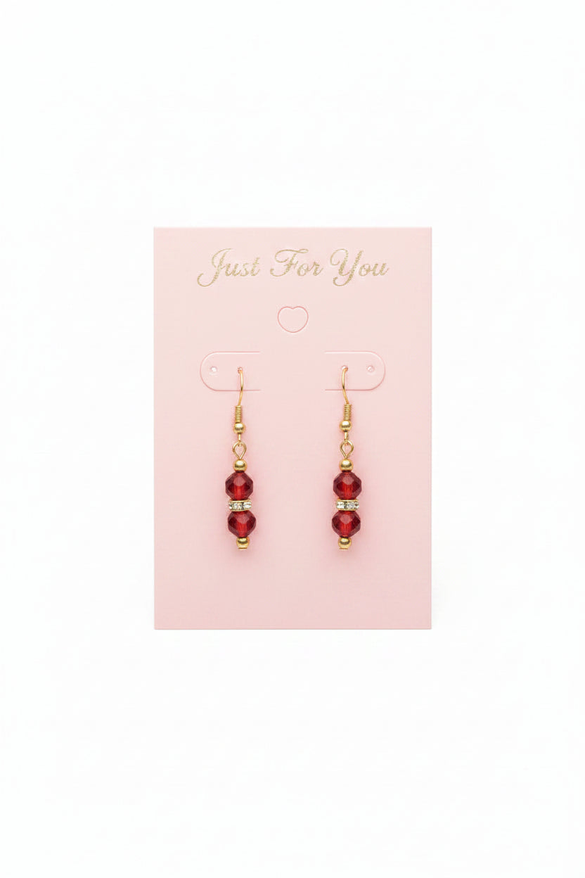 Red beaded necklace and earrings set on a pink card with 'Jewel to Me' branding.