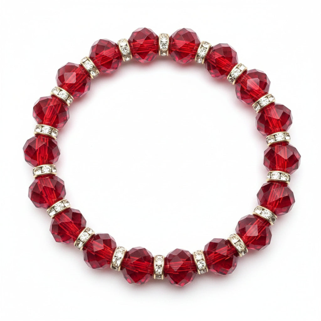 Red beaded bracelet with gold accents on a purple fabric background